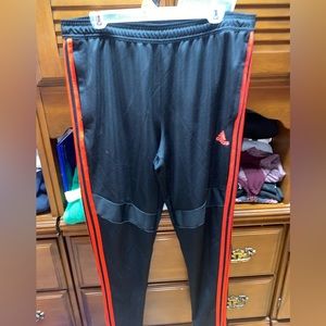 Red and black adidas pants